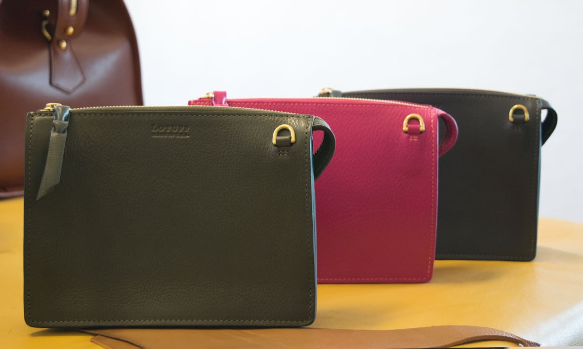 Lotuff Leather Tripp handbag in olive green, magenta, and elephant. 