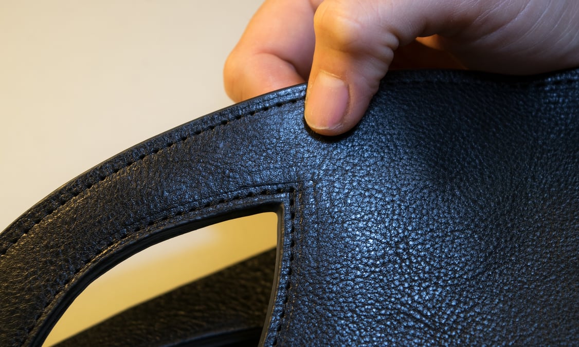Close-up of stitching on Lotuff Leather Rho handbag in black