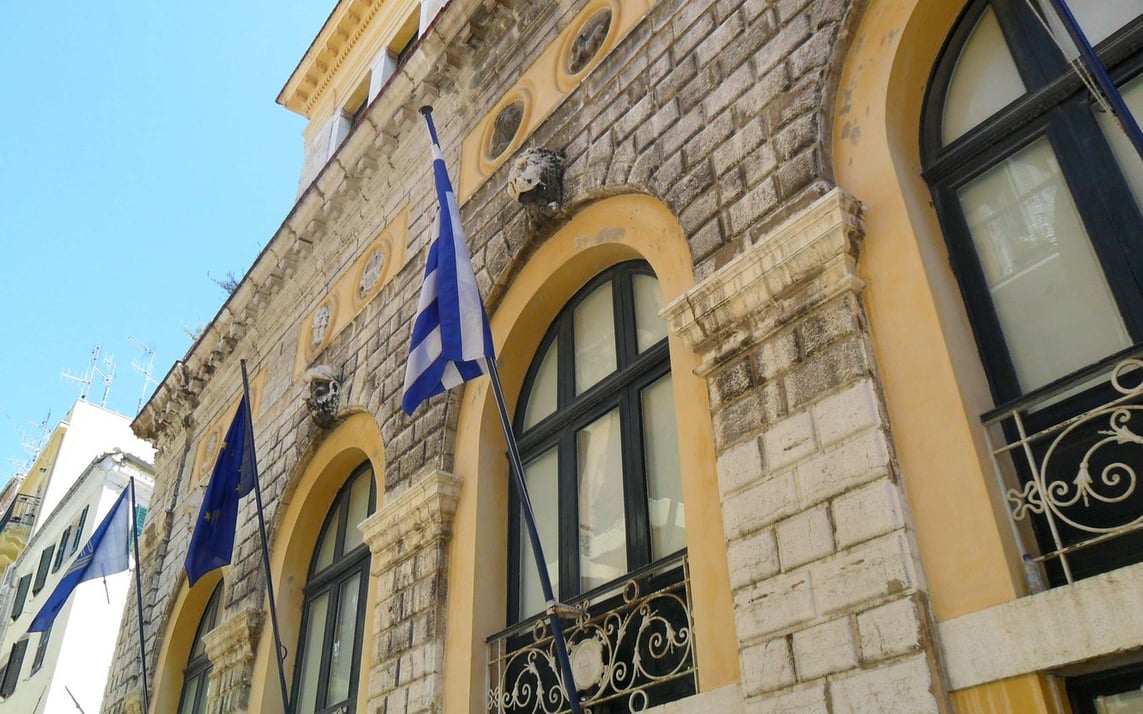 Flags and architecture on the island of Corfu, Greece