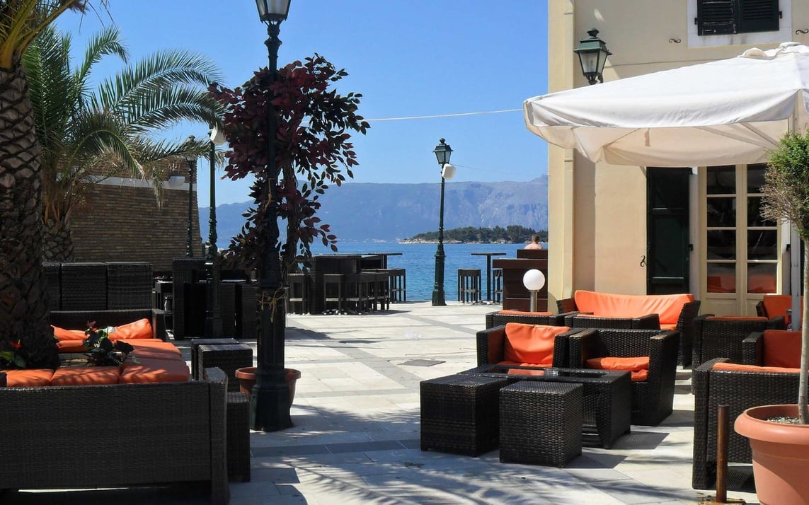 Outdoor waterfront dining at En Plo on the island of Corfu, Greece