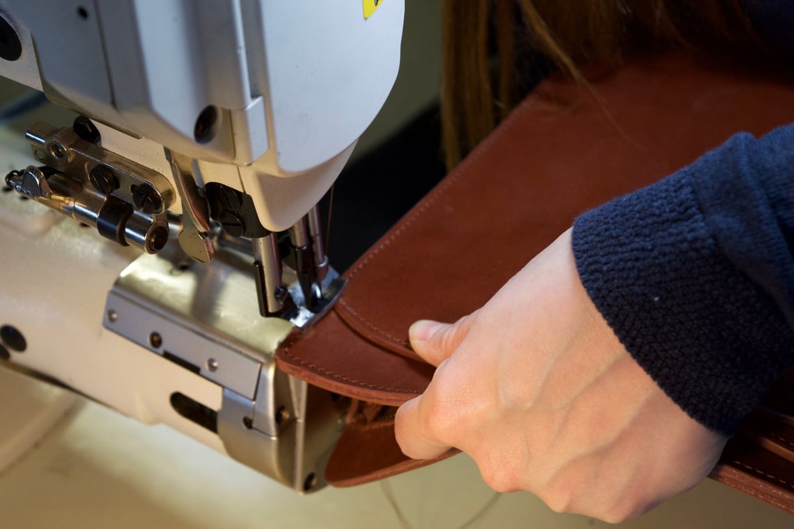 Stitching the Lotuff Leather Wells Briefcase in cognac bridle