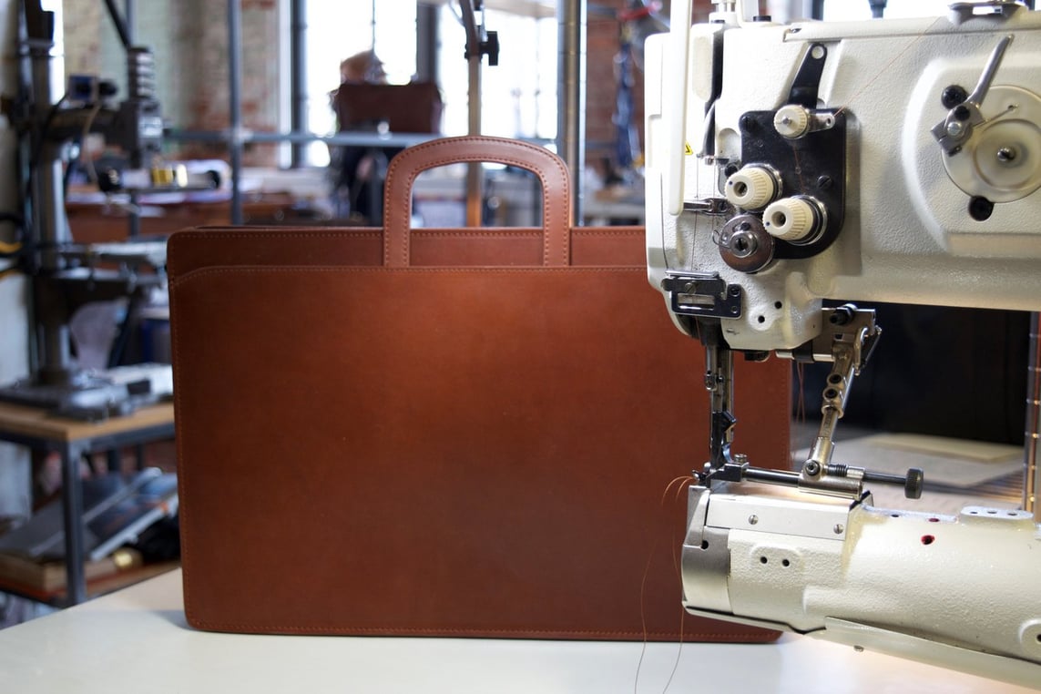 Stitching the Lotuff Leather Wells Briefcase in cognac bridle