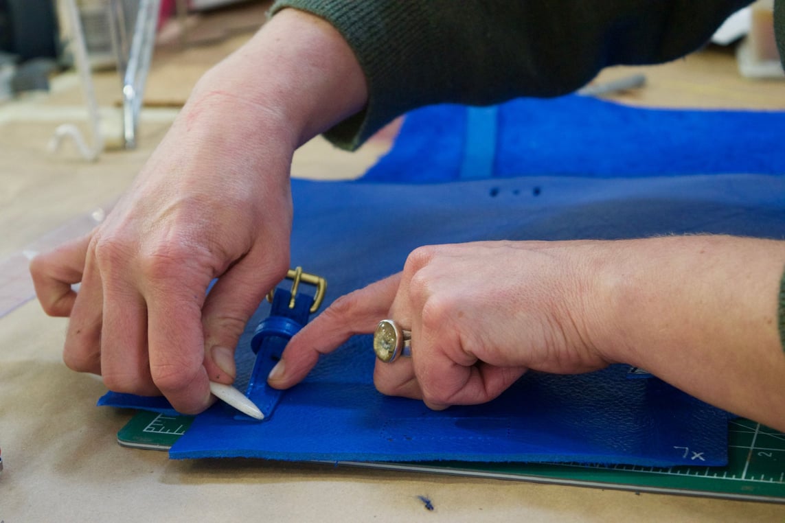 Assembling the Lotuff Leather Mini Sling in electric blue