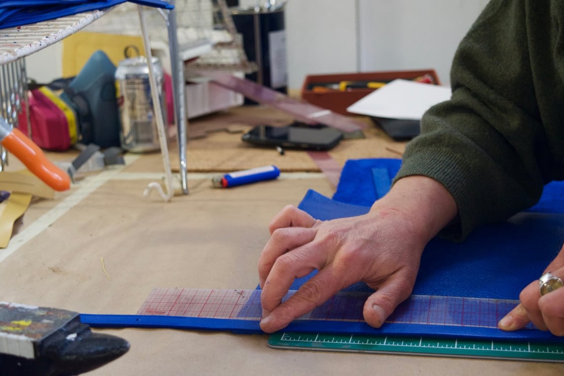 Assembling the Lotuff Leather Mini Sling in electric blue