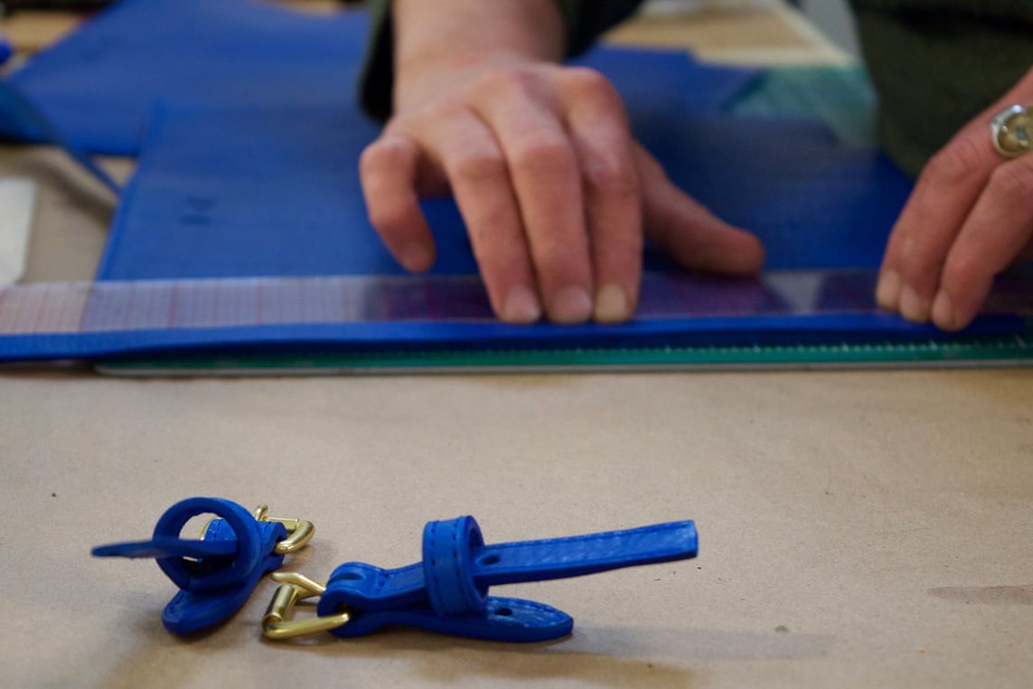 Assembling the Lotuff Leather Mini Sling in electric blue