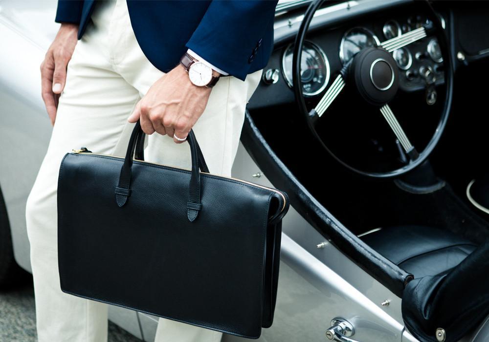 Lotuff Leather Triumph Briefcase in black with vintage Volvo Lotuff Leather Triumph Briefcase in black with vintage Volvo