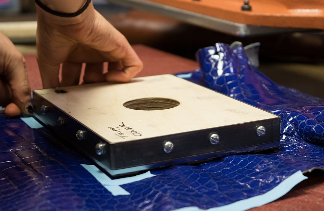 Cutting the leather for a Lotuff American Alligator Tripp handbag