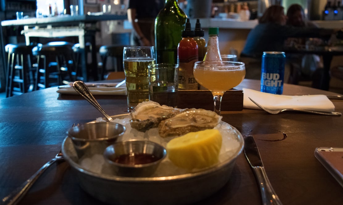 Virginia oysters and drinks at Leon's Oyster Shop in Charleston, South Carolina