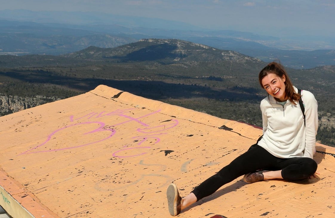 Liz at the summit of the Montagne Saint-Victoire in Aix-en-Provence, France