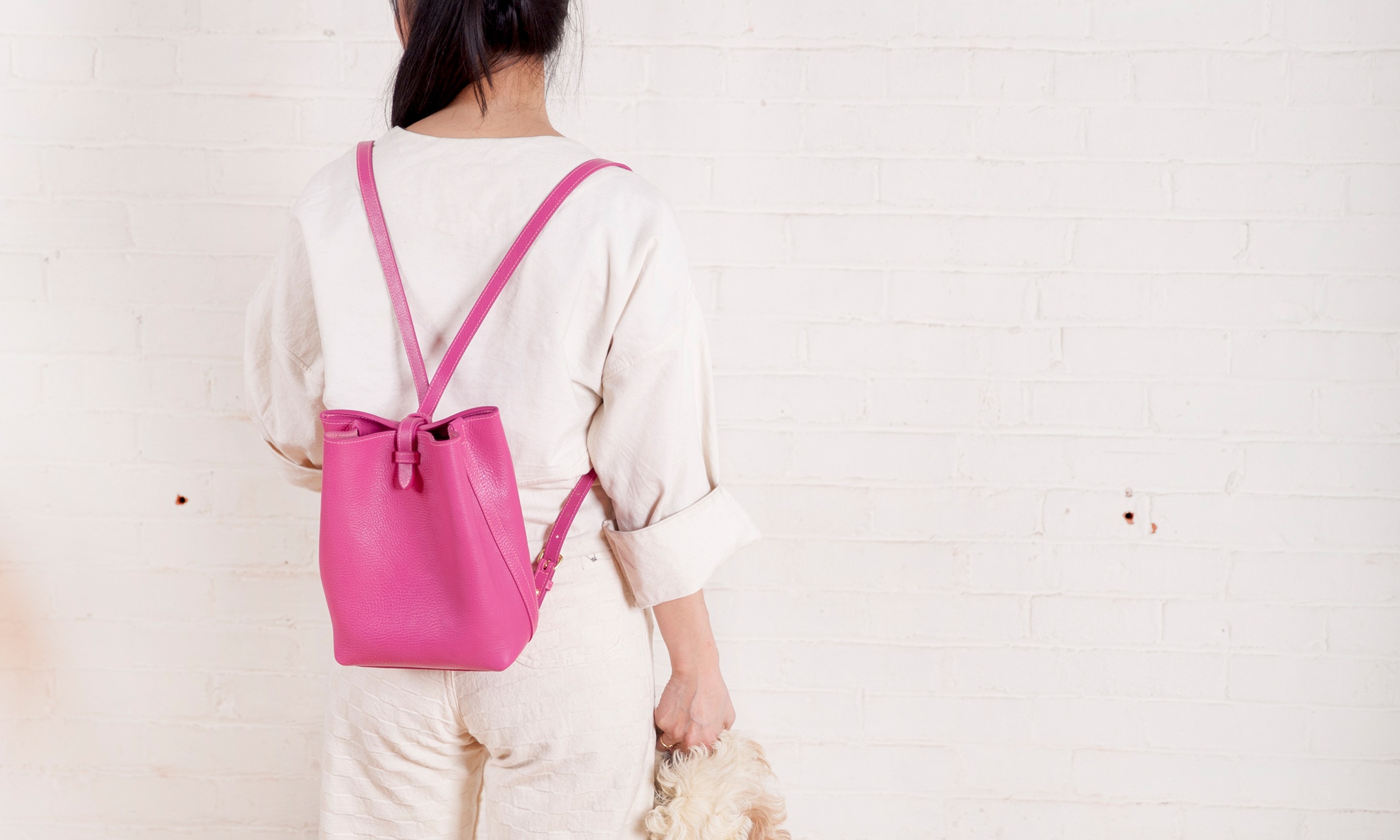 Lotuff Leather Mini Sling in magenta magenta