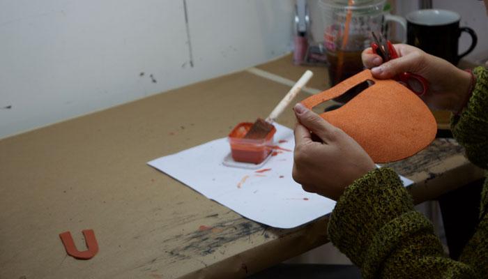 Painting and polishing the Mini Luna handbag