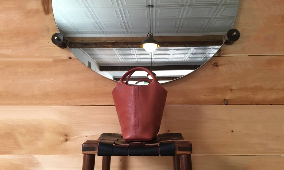 Lotuff Leather One-Piece in rosewood x Michael Robbins stool and Allied Maker lighting