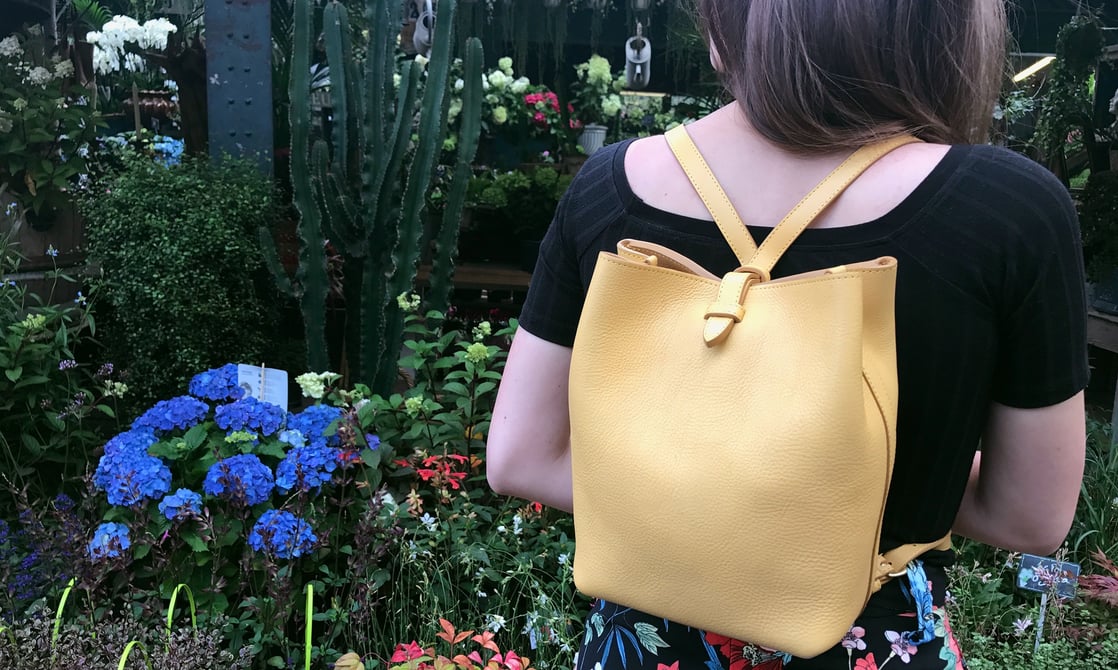 Lotuff Leather Mini Sling in ochre at the flower markets of Paris