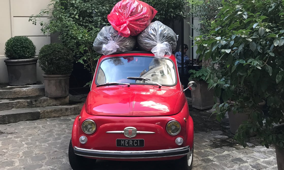 Quintessential red Fiat 500 outside of Merci Paris