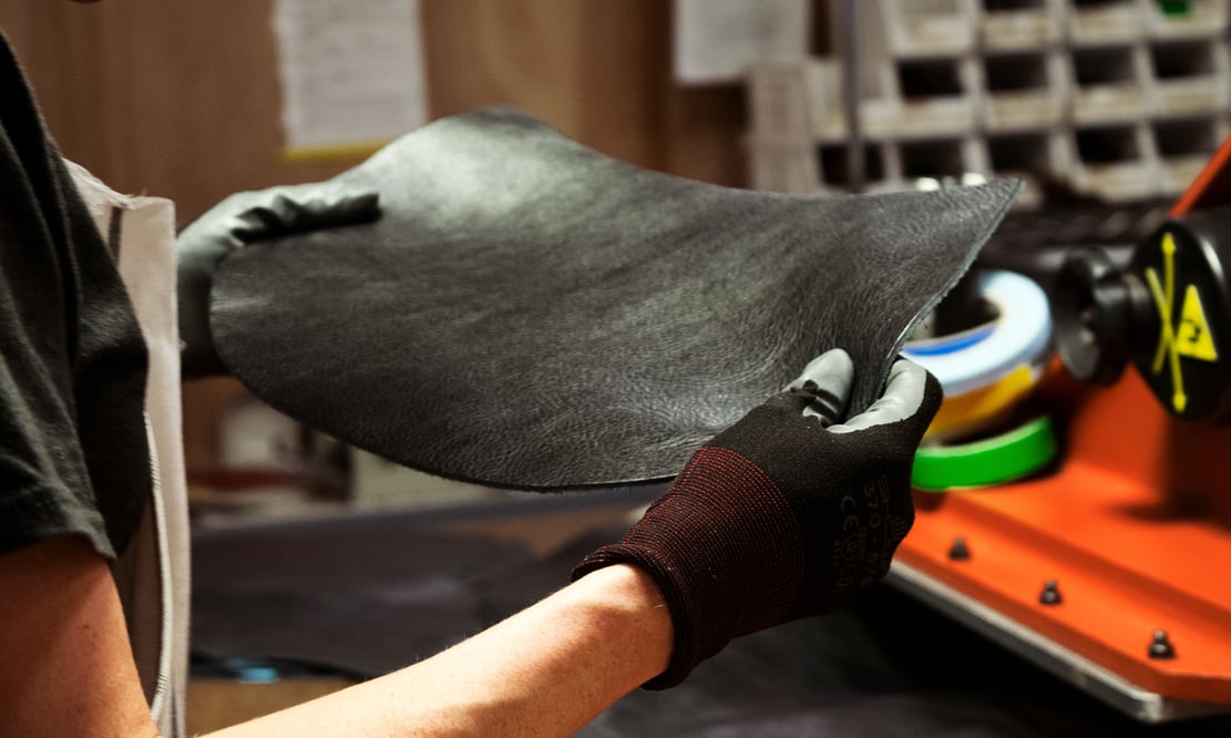 Cutting the Lotuff Leather Rho handbag in black