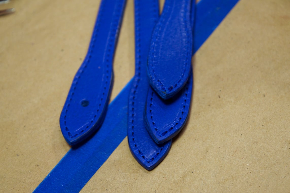 Lotuff Leather No. 12 Business Tote electric blue straps being turned and burned